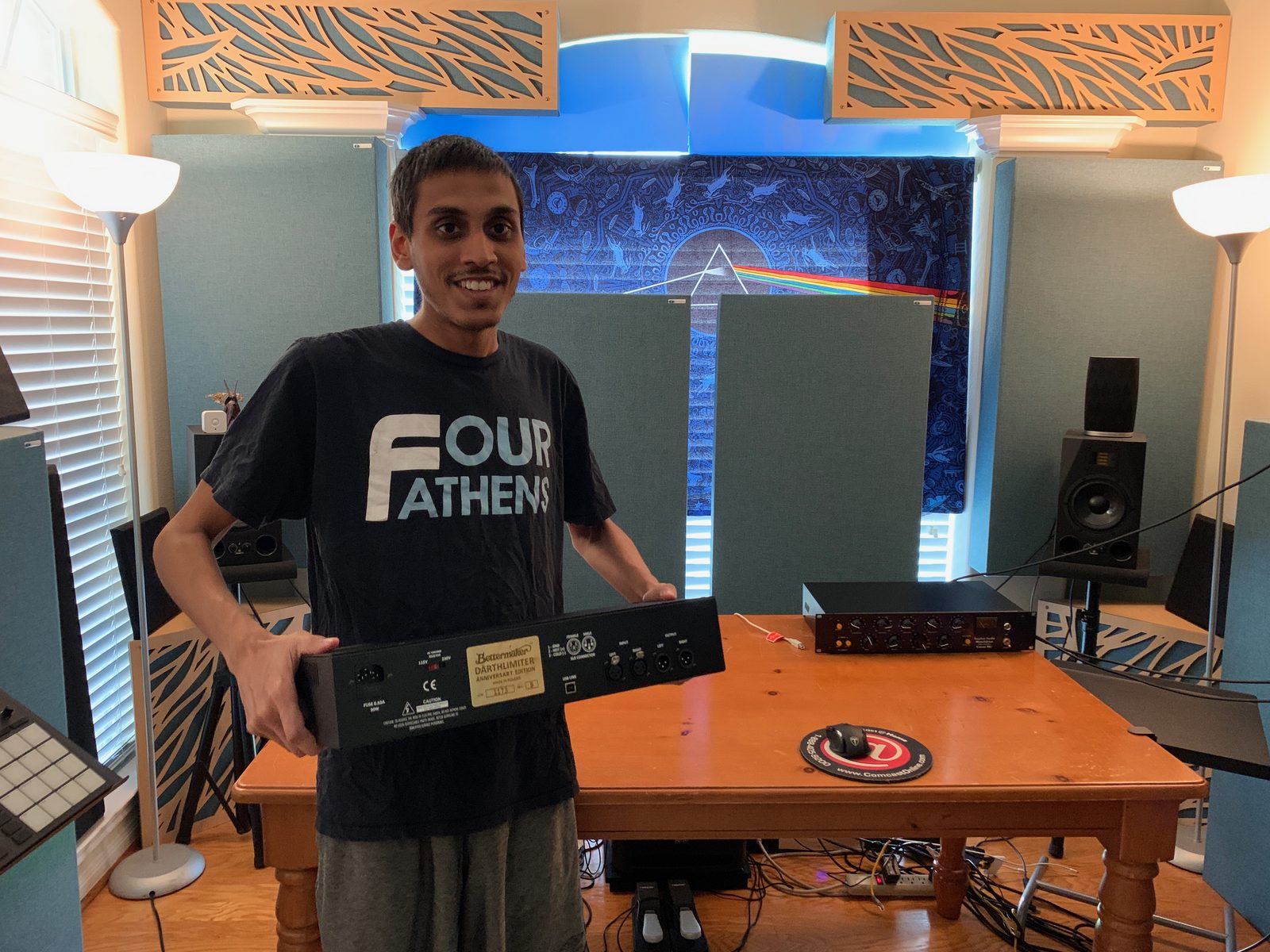 Dilawar Zaman in the studio, holding a Bettermaker Darth Limiter