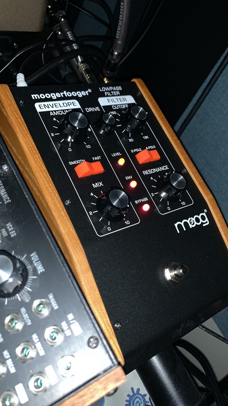 Close-up of a Moog analog filter pedal's controls